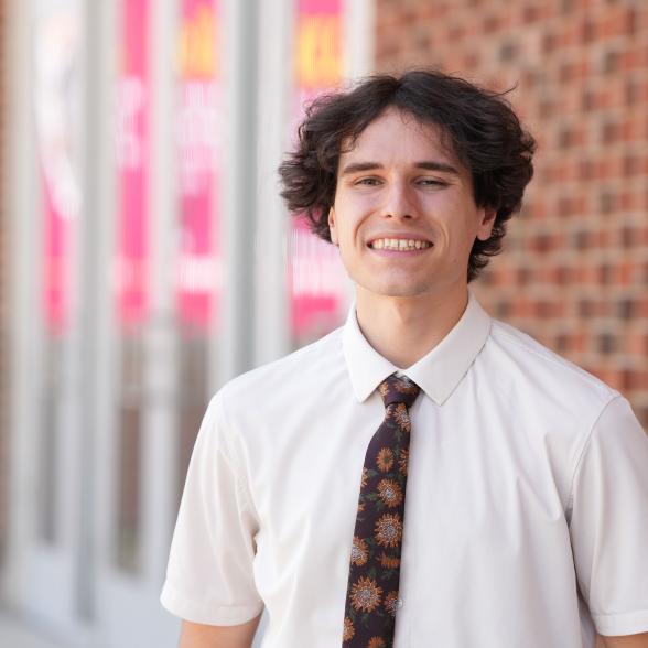 Jake Tiger poses for picture on campus