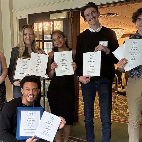 Rider News students posing with awards