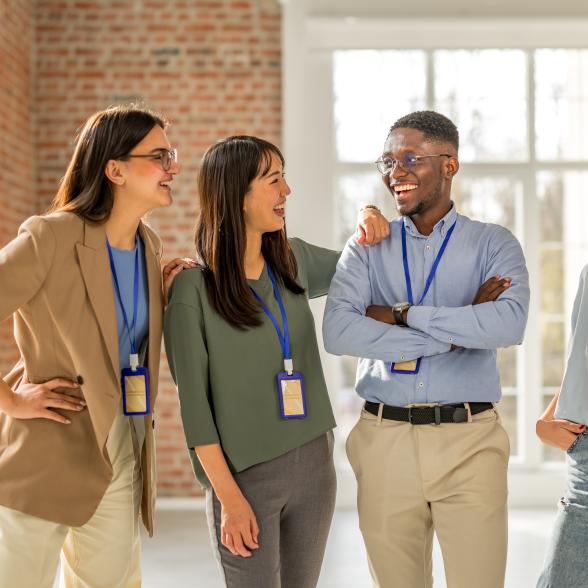 colleagues discussing and laughing in a group