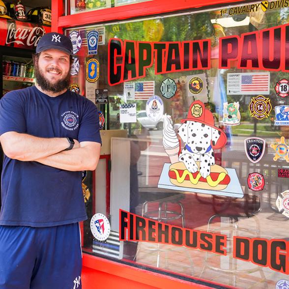 Patrick Jones standing outside Hot Dog store