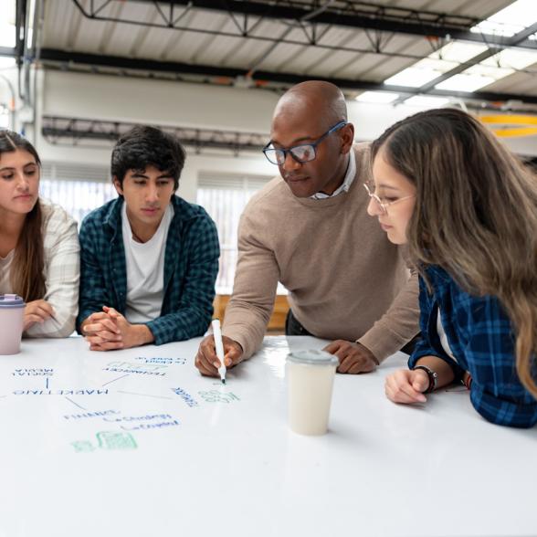 Business faculty leads students in a lesson