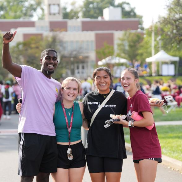 Students smile and wave while attending Cranberry Fest