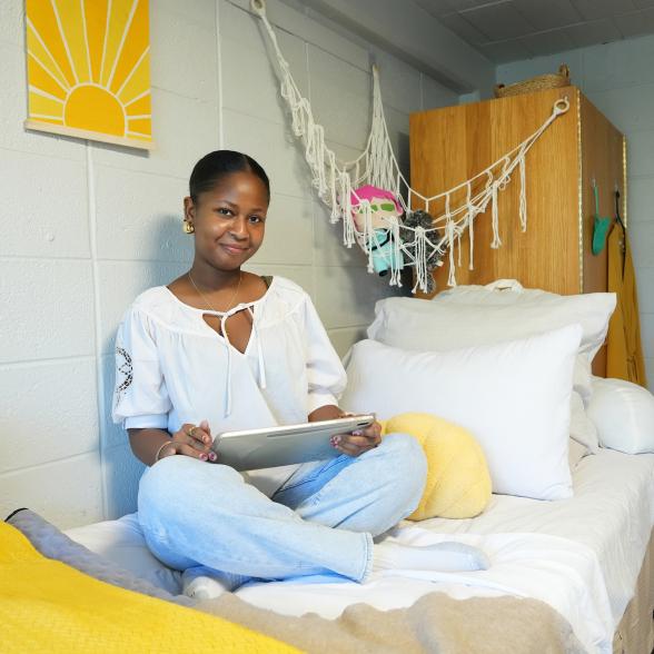 student in dorm room