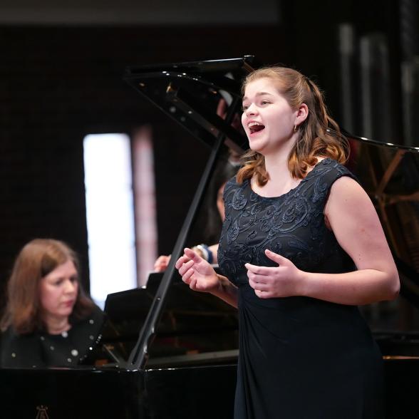 Student singing at a performance
