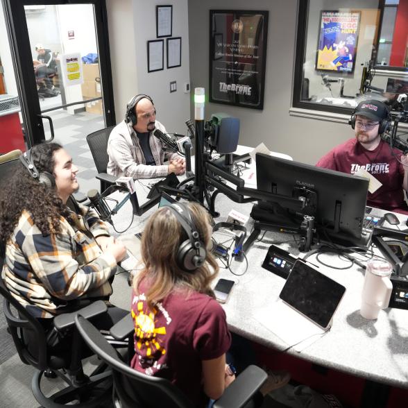 A group broadcasts from the radio station