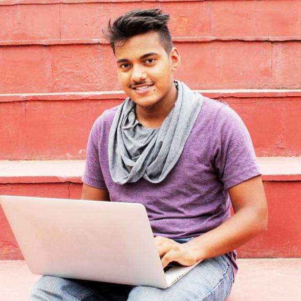 Young man sitting with his laptop