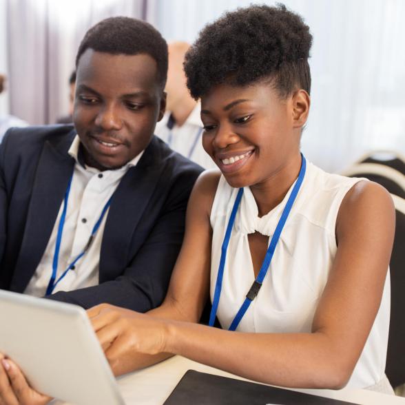 Two colleagues look at presentation