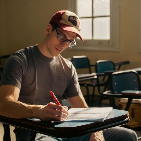 Veteran sitting at desk writing