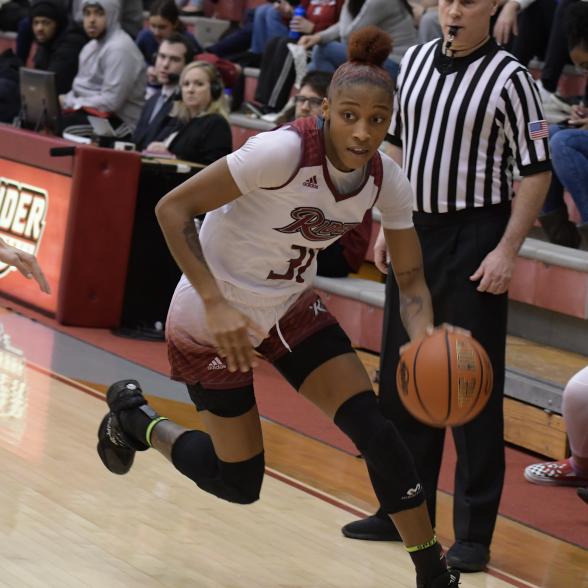 Amari Johnson drives to the hoop in a game at Alumni Gym