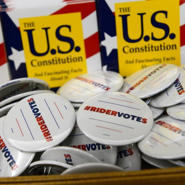 Pins advertising RiderVotes initiative