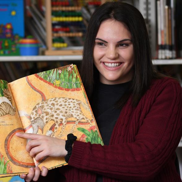 Teacher reading in a classroom
