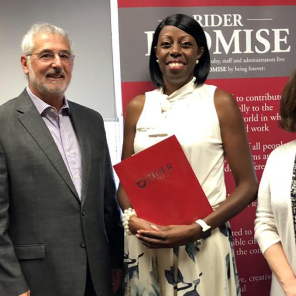 Nicole Dickens-Simon with Rider administrators