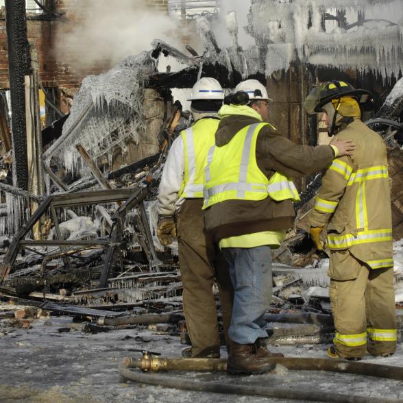 Responders commiserate following a fire