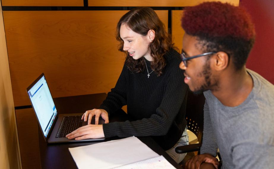 Two students working at a desk