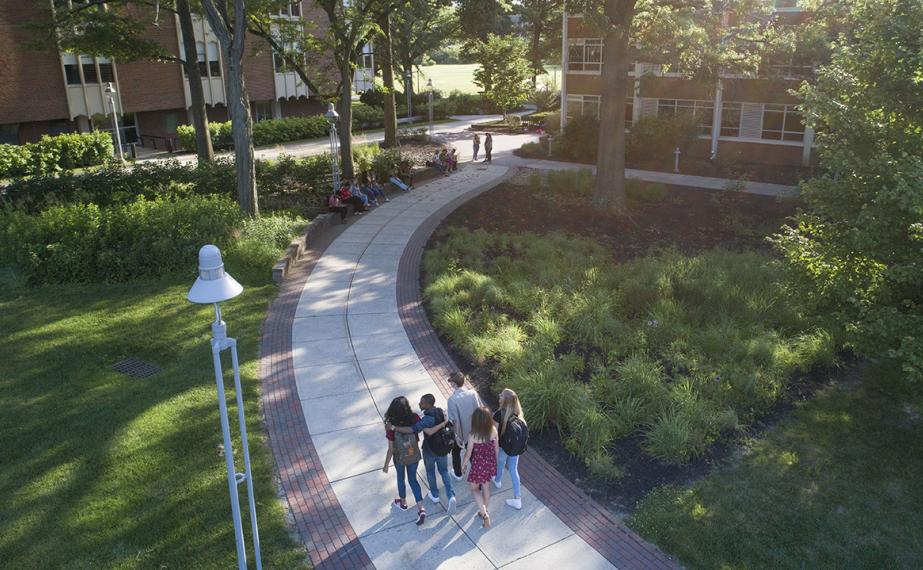 A group of students walking across campus