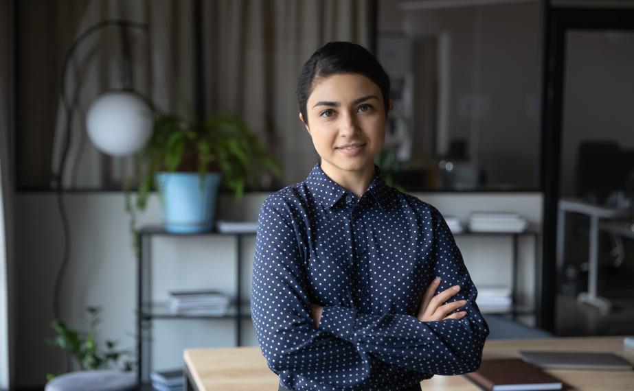 Young business woman stands with confidence