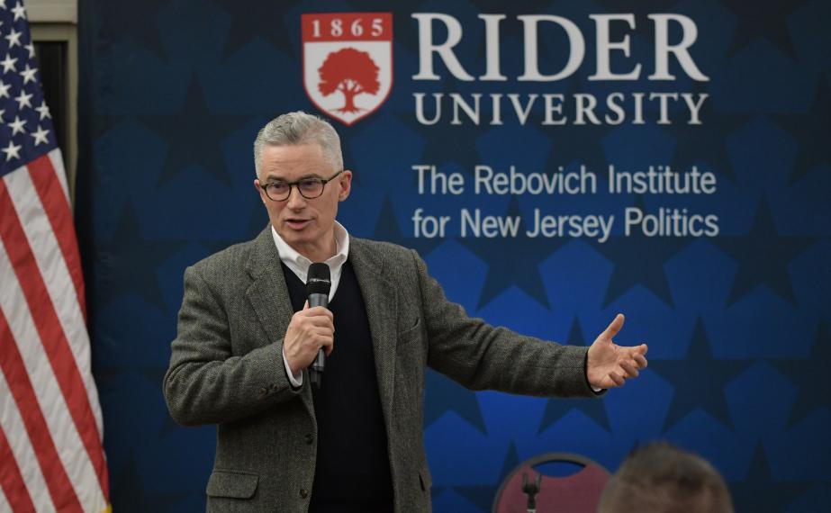 Man speaks at Rebovich Institute event