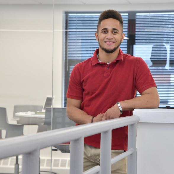 Professional looking student standing in the business building