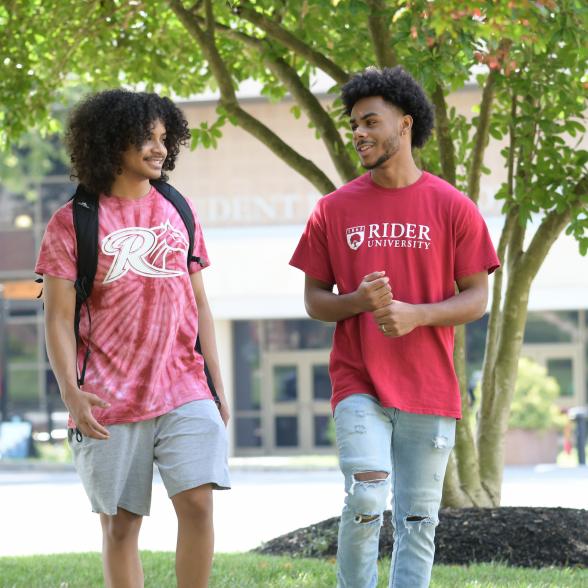 Two students walking near student recreation center