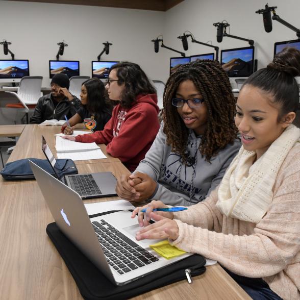 Two students collaborate on an academic project