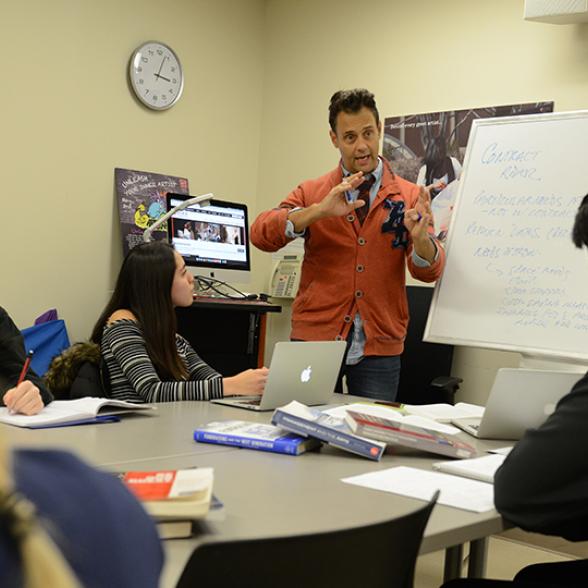 Professor teaches intimate classroom of students