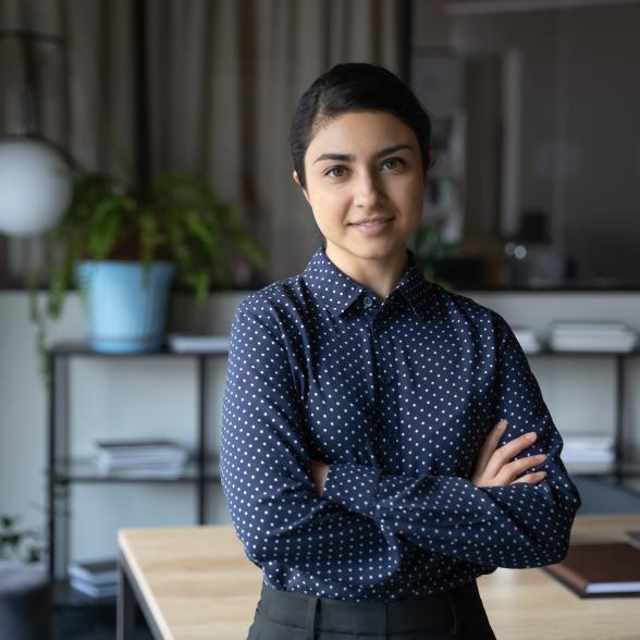 Young business woman stands with confidence