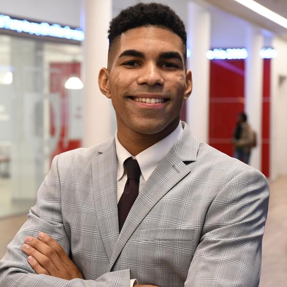 Business student with arms crossed