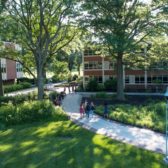 Students walk across academic quad