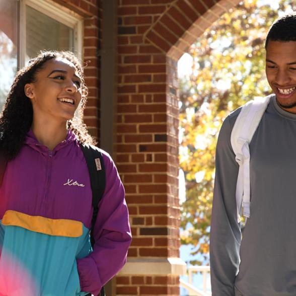 Two students walk to class