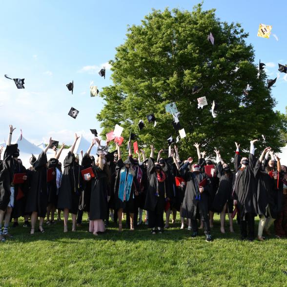 2021 graduates toss their caps