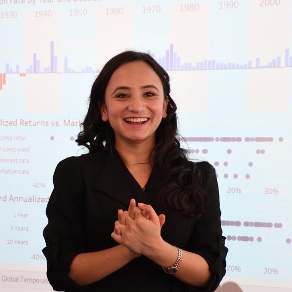 Students smiles in front of business presentation