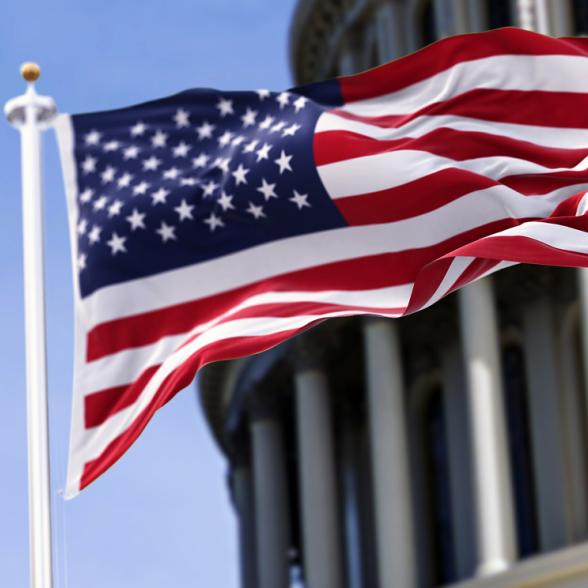 American flag in front of capital building