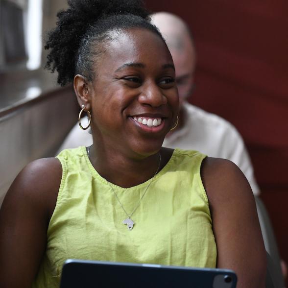 Graduate student smiling in class