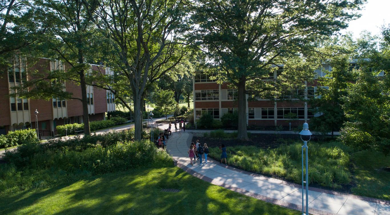 Students walk through academic quad