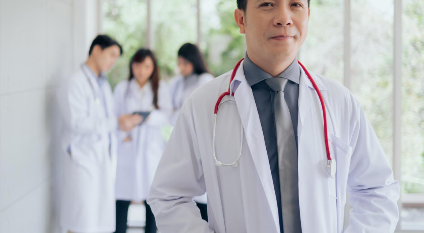 Nurse talks with elderly patient