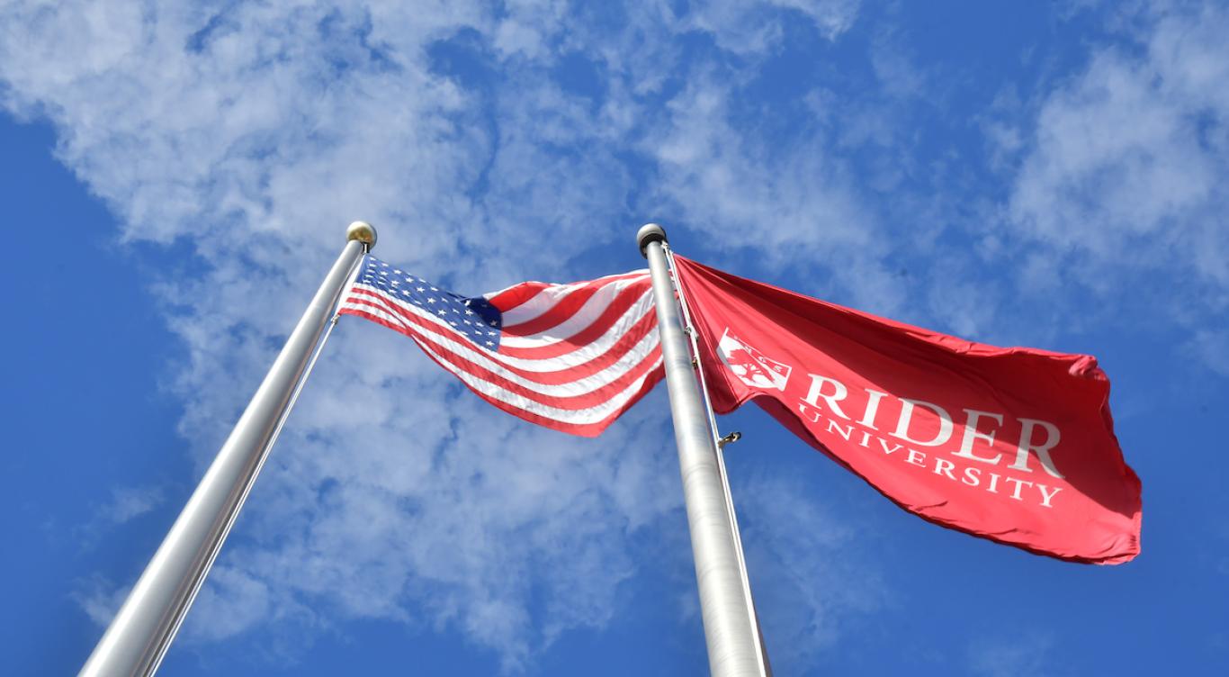 American flag and Rider flag on campus