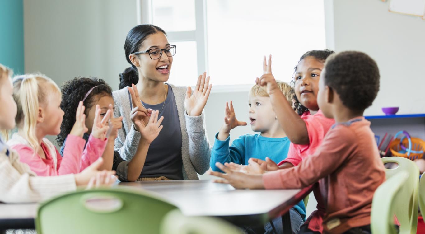 Teacher engages children with a game