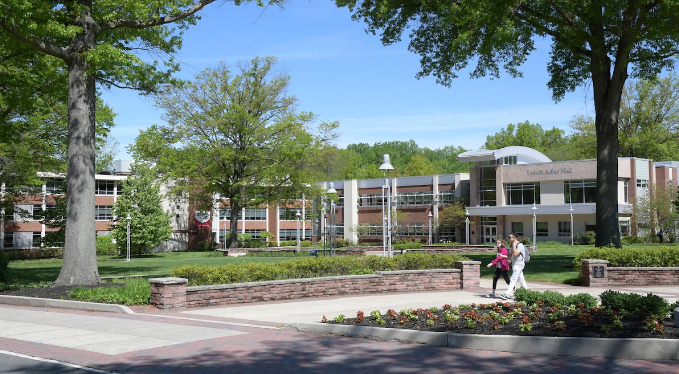Students walk near Lynch Adler hall