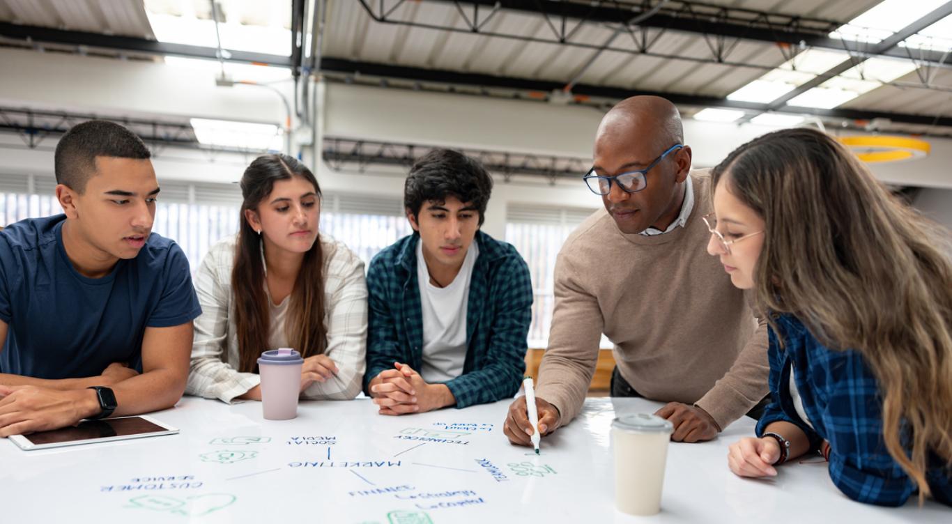 Business faculty leads students in a lesson