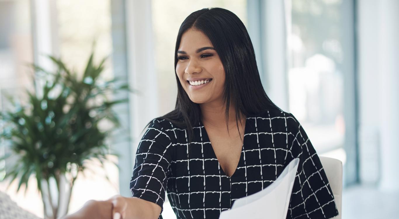 Young woman greets interviewer