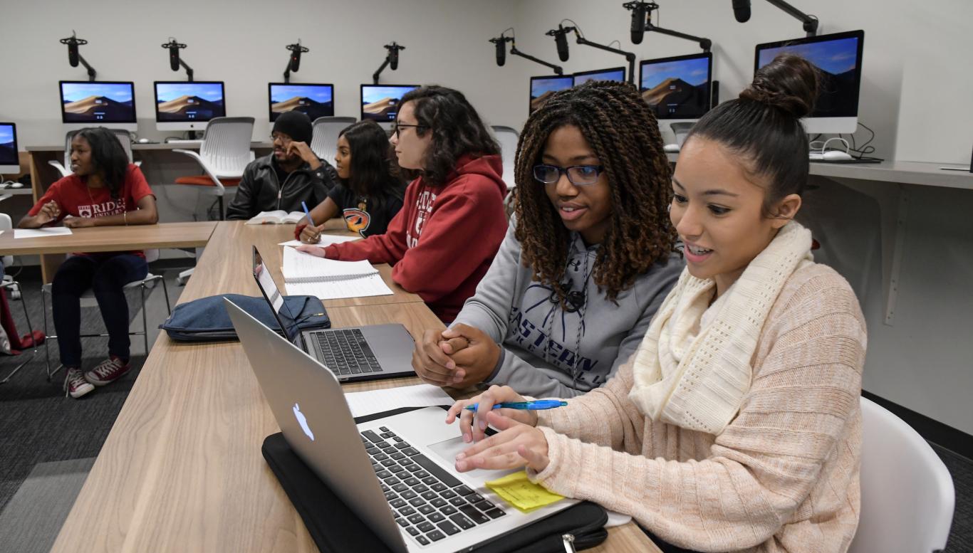 Two students collaborate on an academic project