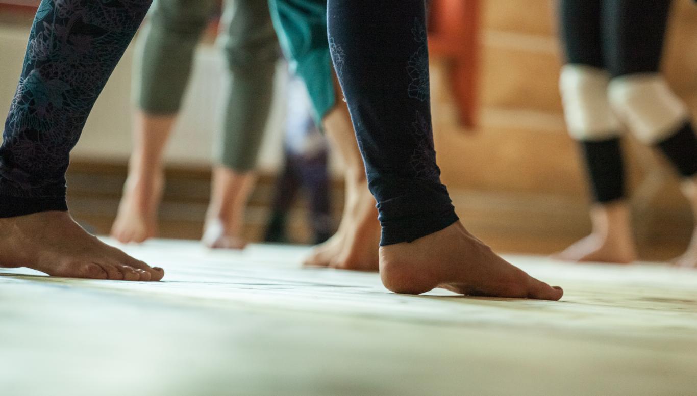 Feet in a dance studio.