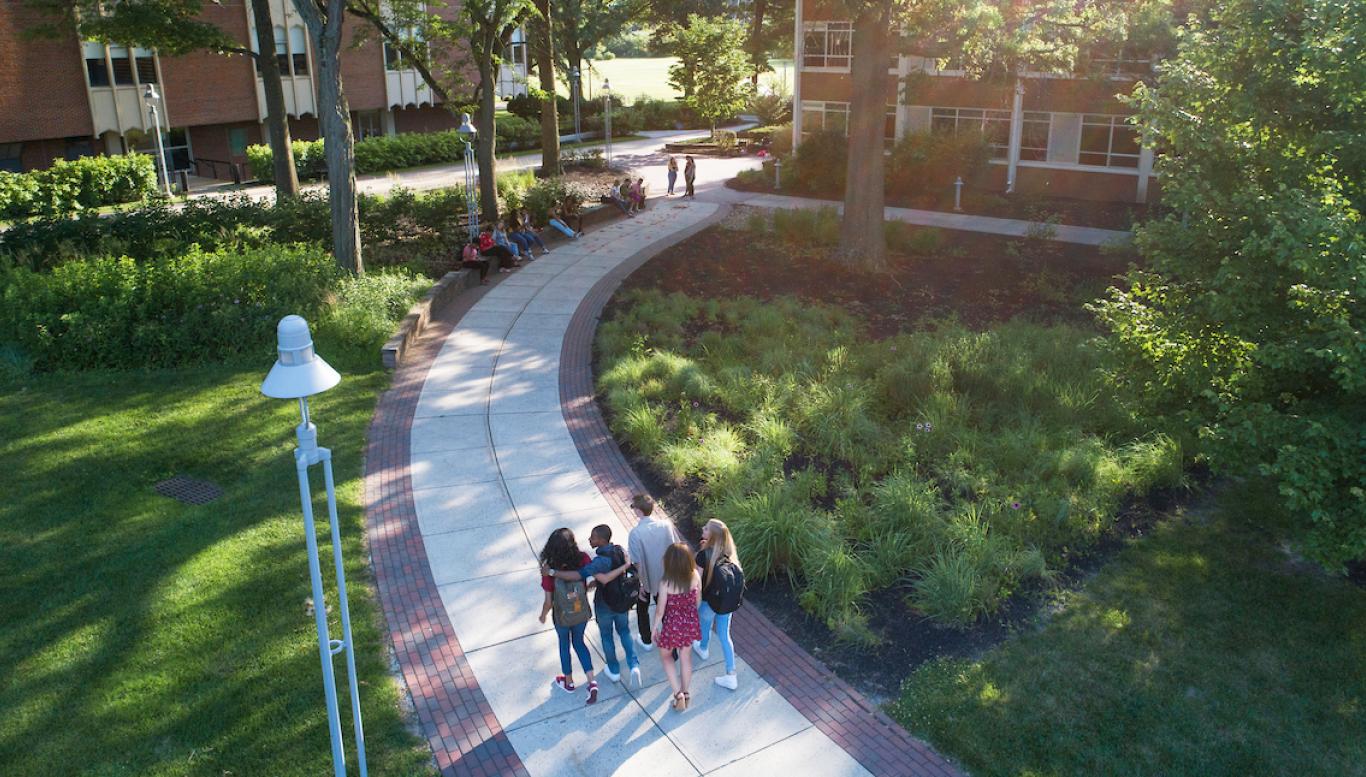 Students walk to class in summer