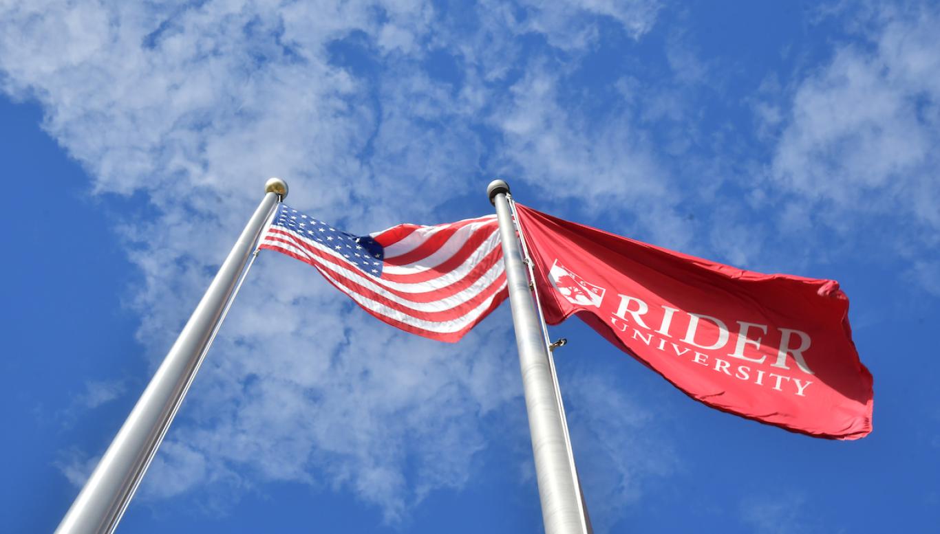 American flag and Rider flag on campus