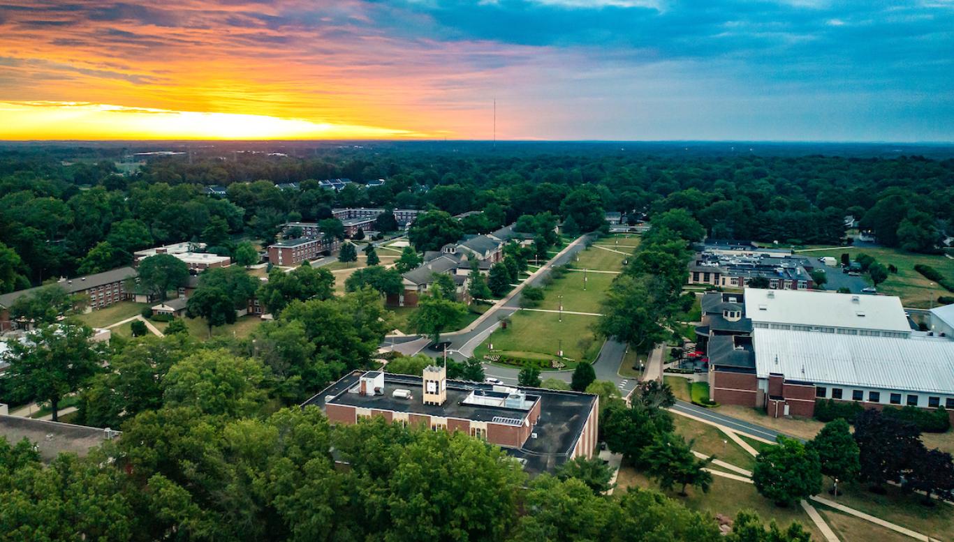 Bird's eye view of sunrise over campus