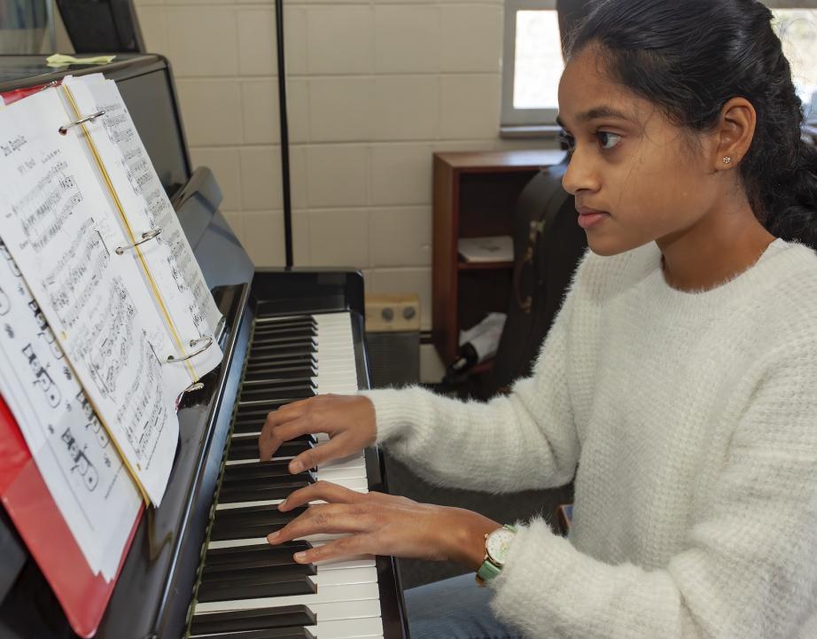 Conservatory student playing the piano