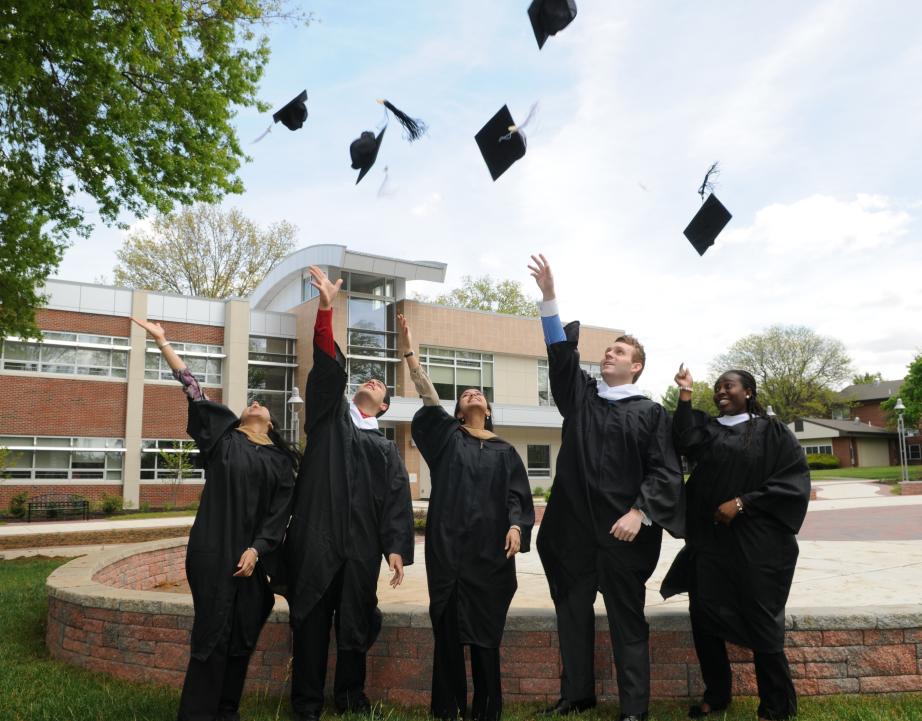 Rider graduates toss their caps at commencement