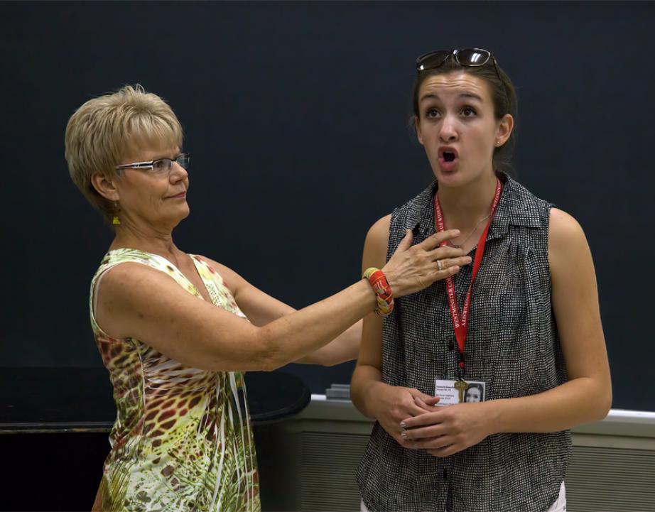 Faculty member teaches voice student.