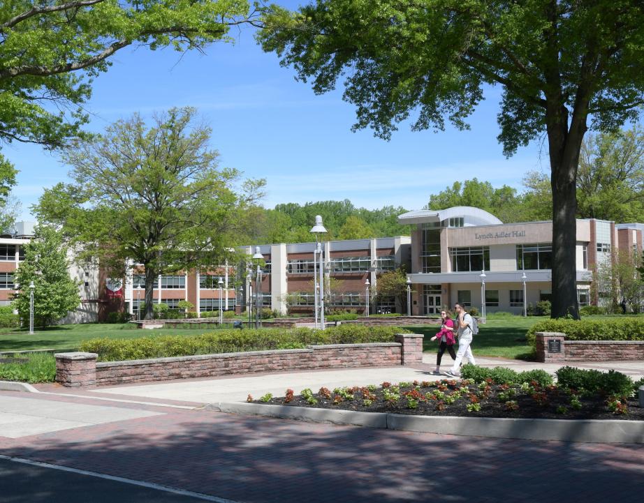 Students walk near Lynch Adler hall