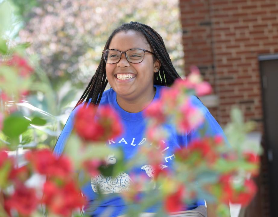 Student smiles on campus